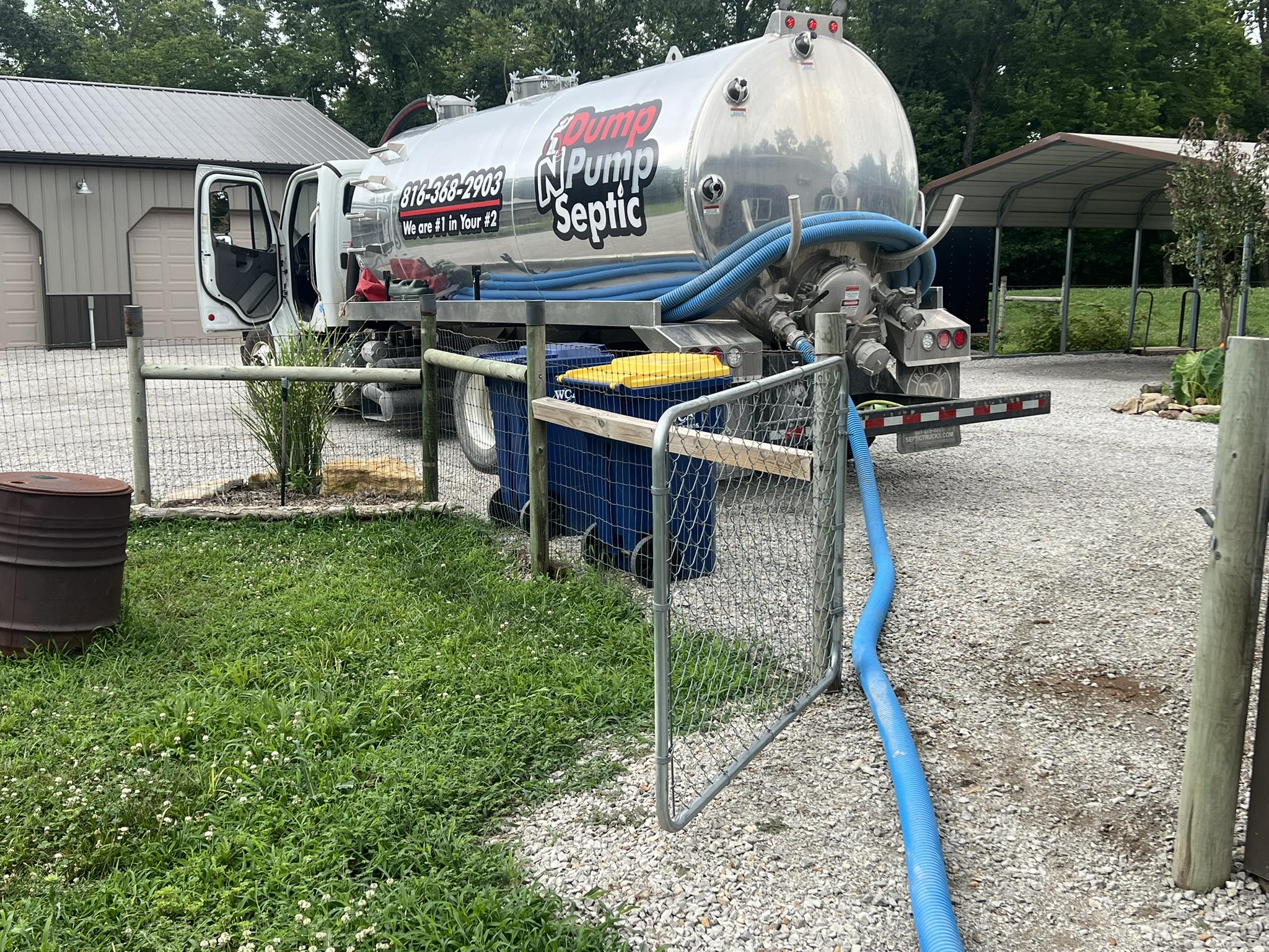 Dump N Pump truck carefully positioned at a residential property