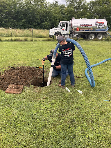 Dump N Pump Septic crew working on a septic system