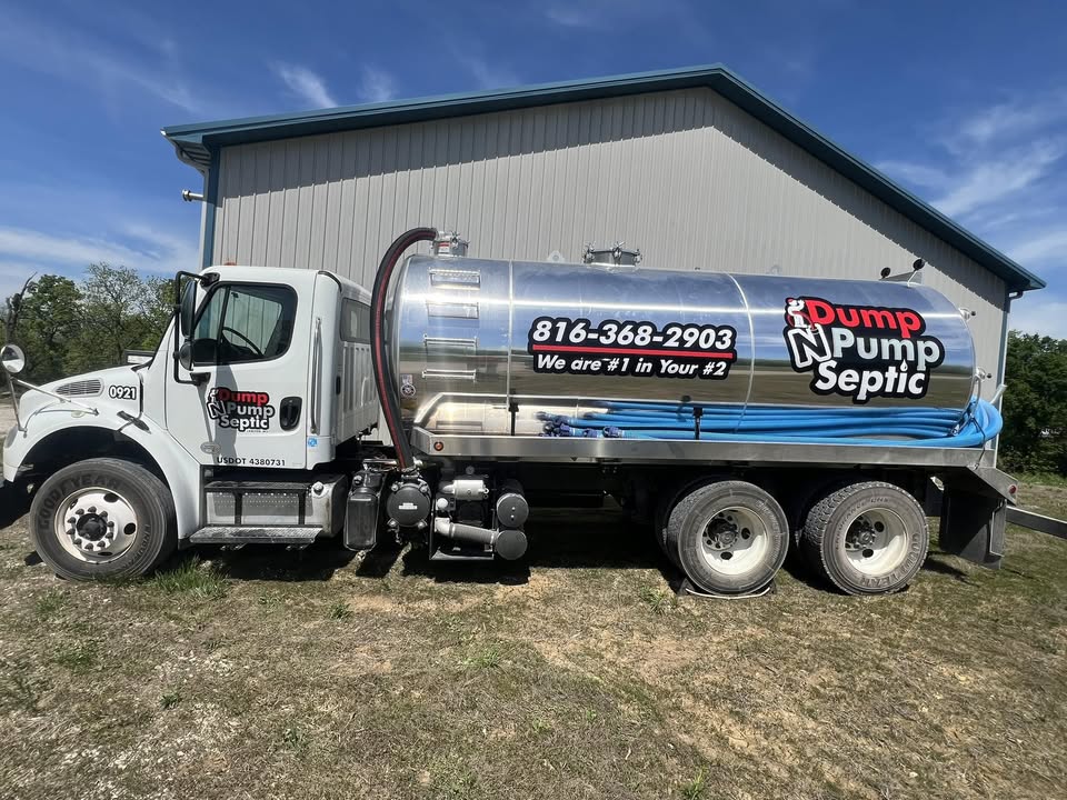 Dump N Pump Septic truck in front of shop